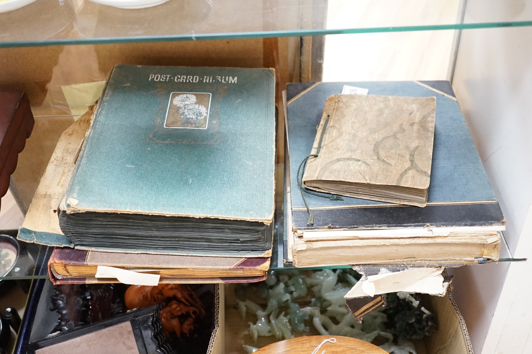 Four Victorian scrap albums and postcard albums, including one of late 19th century Christmas cards, an album of early 20th century architectural photographic postcards, etc. Condition - fair